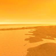 Illustration for article titled What strange geological processes created Titans oddly smooth surface?